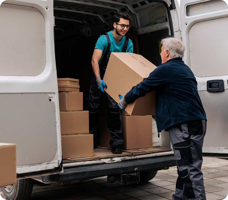 Workers unloading boxes from a van