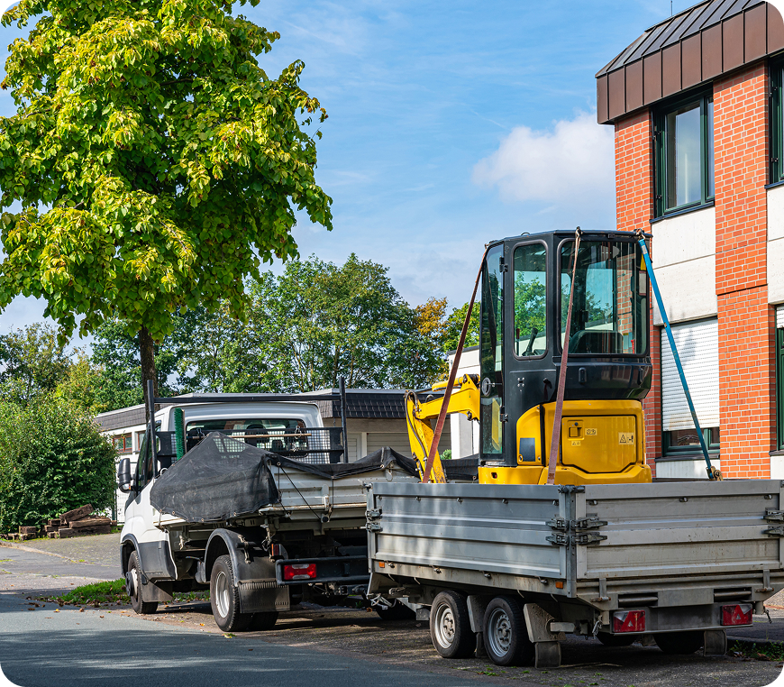 Truck and trailer parked near building